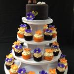 Cowboy Boots and Flip Flop Keepsake Cake Toppers on top of a Tower of Cupcakes with handmade Flowers